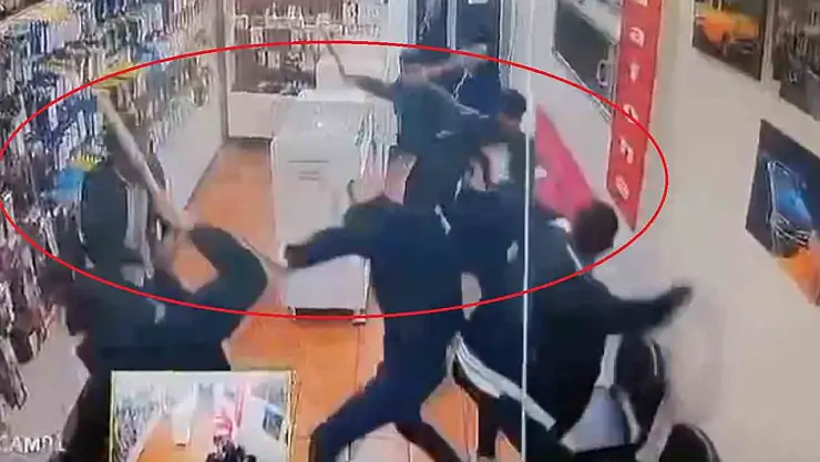 Sopalarla bastıkları iş yerindeki kişileri darp ettiler